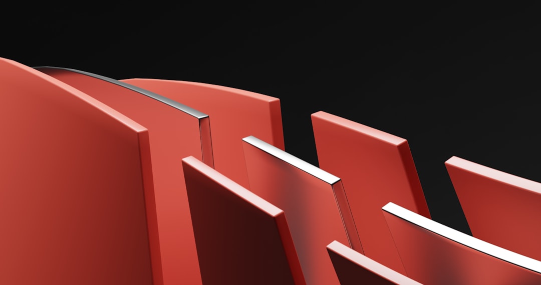 a-row-of-red-chairs-sitting-next-to-each-other-ziyjpxfziau